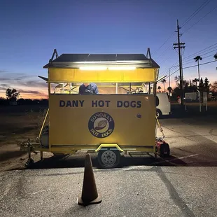 a yellow food cart