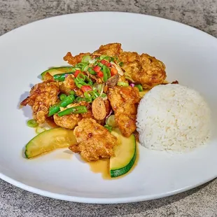 a plate of food with rice and vegetables