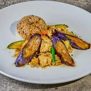 a plate of food with rice and vegetables