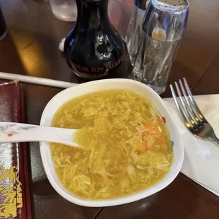 Egg drop soup but you do have a choice of another soup. Never had this with corn kernels in it but was still good.