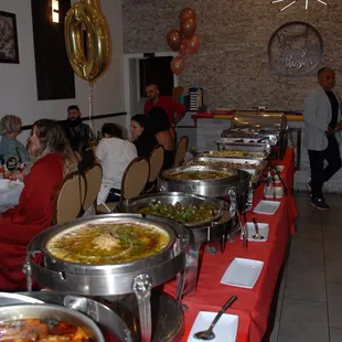 a buffet table with food on it
