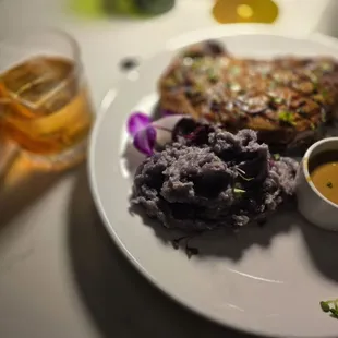 Ribeye with purple garlic mashed potatoes.  Steak was a perfect medium rare. It's one of the best Ribeyes in the IE.