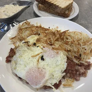 Corned beef hash and eggs, Greek toast, and sausage gravy for the hash browns.