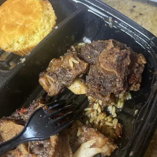 Dry and tough Oxtail, with cupcake cornbread