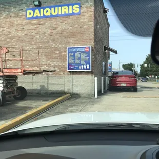 a view of a parking lot from inside a car