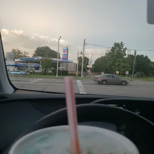a drink in a cup with a straw