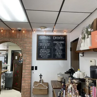 a brick wall with a chalkboard on it