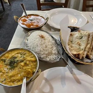 a table with a variety of dishes of food