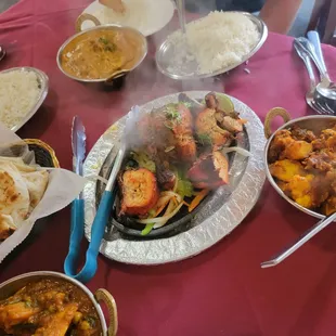 The grilled item with the tongs was too overcooked on the chicken; and ended up being a little drier than normal, according to our friend.