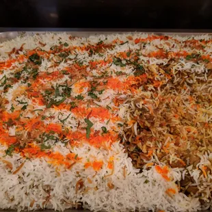 a tray of rice and vegetables