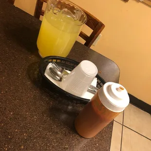 Complimentary pineapple juice and their homemade hot sauce