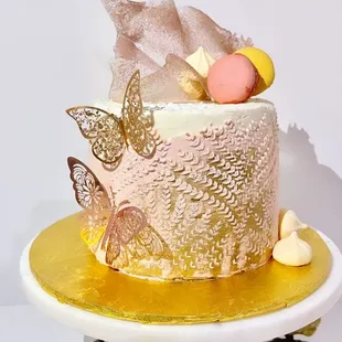 a cake decorated with butterflies