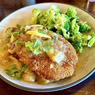 Huge Tilapia Filet with a wonderful lemon butter drizzle on a bed of diced potatoes and steamed broccoli, WOW!