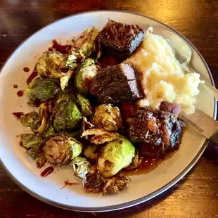 Absolutely delicious Bison Shortribs, slow cooked in red wine reduction -- melts in your mouth!