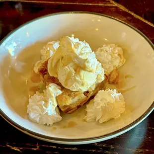 Incredible homemade bread pudding with whipped cream &amp; whiskey!