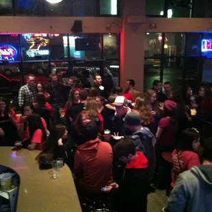 a large group of people in a bar