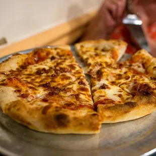 Small pizza with extra cheese and bacon