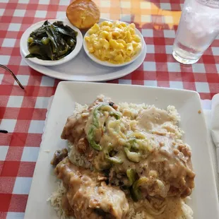 Smothered chicken, rice &amp; gravey mac &amp; cheese and greens!