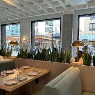 a woman sitting at a table in a restaurant