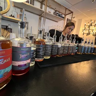 a woman behind a bar counter