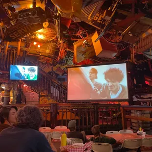 people sitting at tables in a restaurant