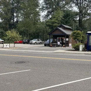 a parking lot with cars parked on the side of the road