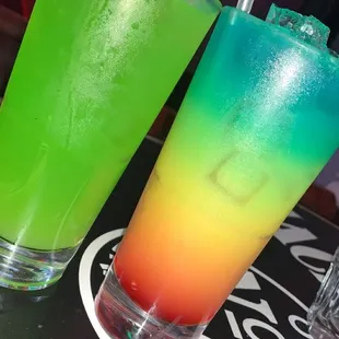 two colorful drinks on a table
