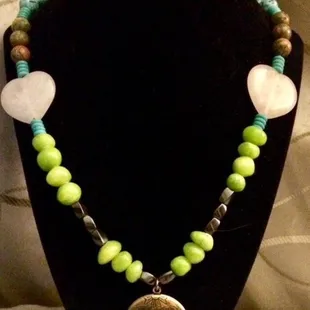 Butterfly locket with lime green Hemetite and natural Hemetite with turquoise and rose quartz hearts on sterling silver