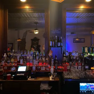 a bar filled with liquor bottles