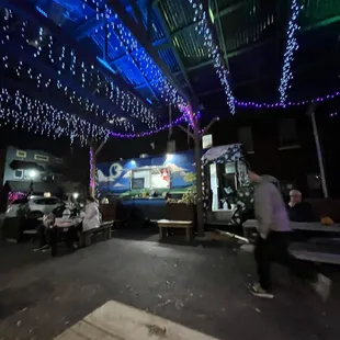 a man riding a skateboard in a parking lot