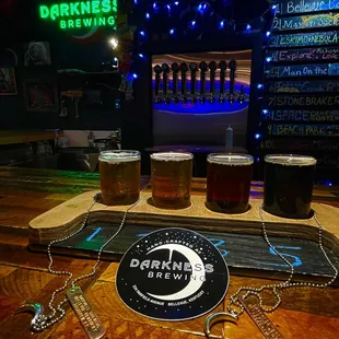 a flight of beers on a bar