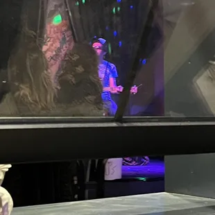 a man standing in front of a window