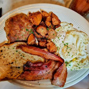 The 2-1-5: 2 eggs your way, bacon, maple bacon sausage patty, roasted rosemary potatoes, and Sourdough toast