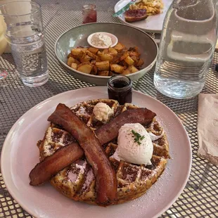 Waffle. Added bacon and eggs and side of potato.