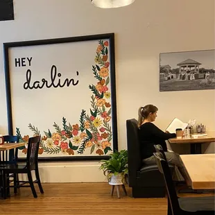 a woman sitting at a table