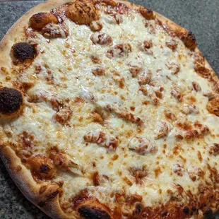 a cheese pizza on a table
