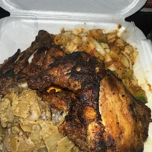 a chicken and rice dish in a styrofoam container