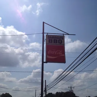 Rather worn Road Sign for Darrell&apos;s BBQ