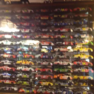 Just one of a number of wall displays of small racing cars.