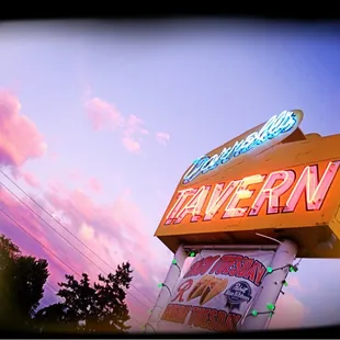 the neon sign for tavern