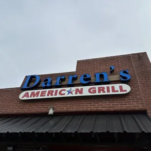 Signage over the corner of the restaurant. Located at Jupiter &amp; Lookout.