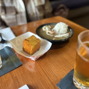 a plate of food and a glass of beer
