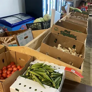a variety of vegetables in boxes