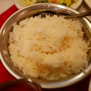 a bowl of rice with a spoon