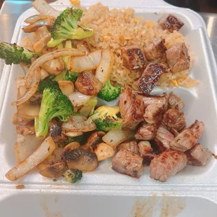 chicken, broccoli, and rice in a styrofoam container