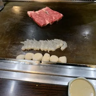 Steak, shrimp and scallops