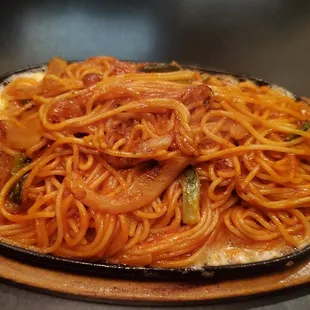 a plate of spaghetti and meat