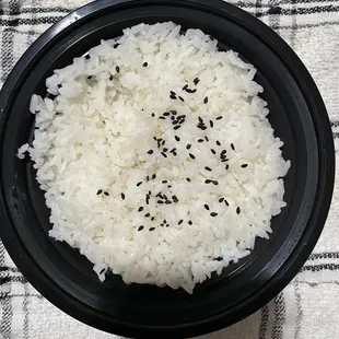 Love that the Steamed Rice comes in a reusable container instead of cardboard .