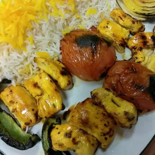 a plate of grilled vegetables and rice