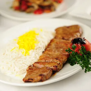 a plate of meat and rice